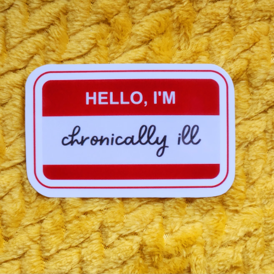 Colorful "Hello, I'm Chronically Ill" sticker on a yellow background.