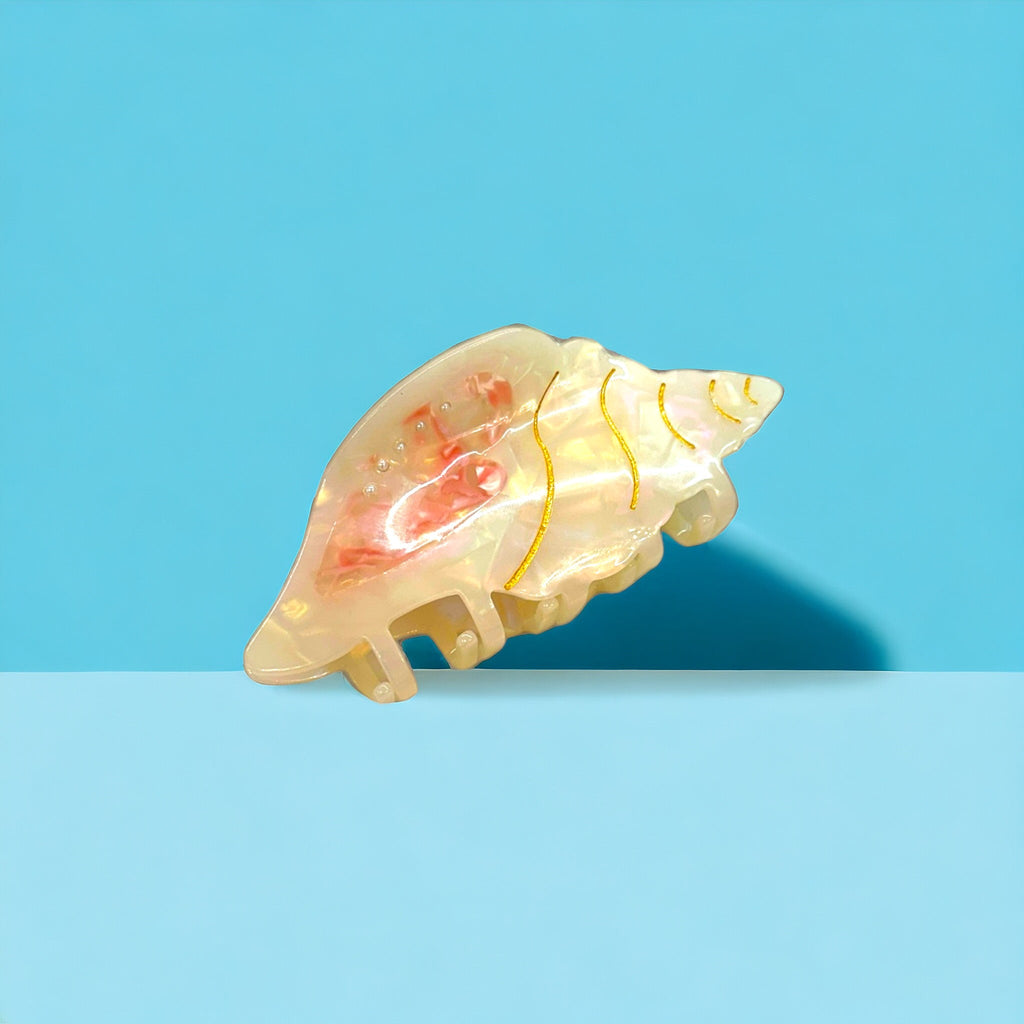 Adorn your hair with this beautiful conch hair clip, perfect for summer beach days.