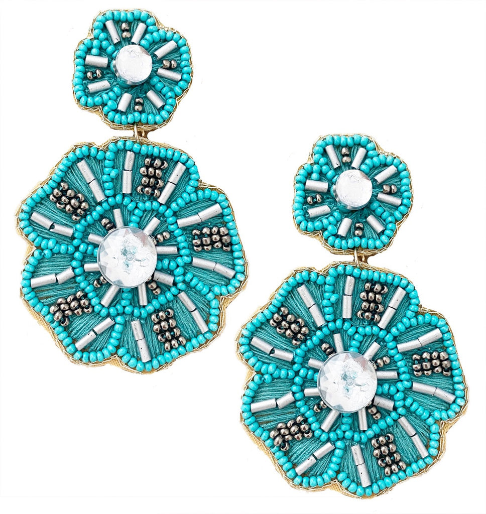 Lightweight aqua earrings featuring a floral-inspired design and a playful "Going Places" patch, perfect for party wear.