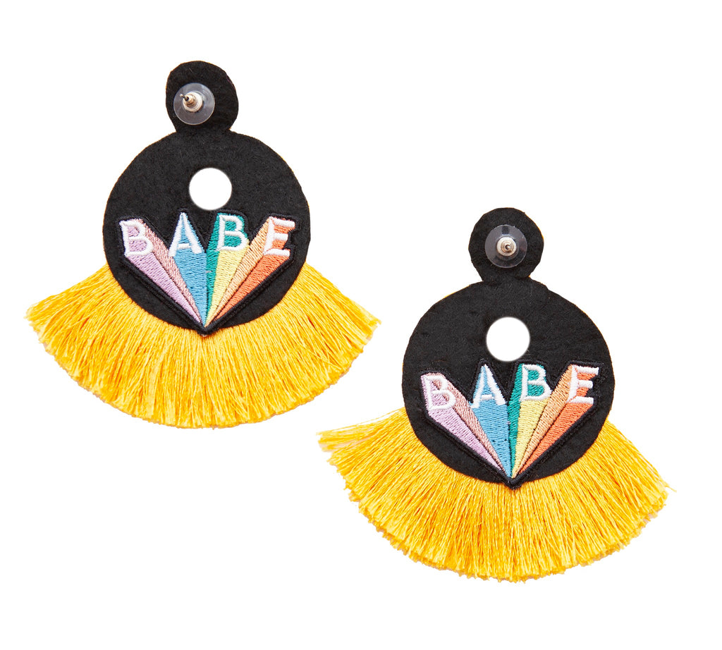 Vibrant yellow statement earrings with beaded fringe and a playful patch design, ideal for spreading positivity.