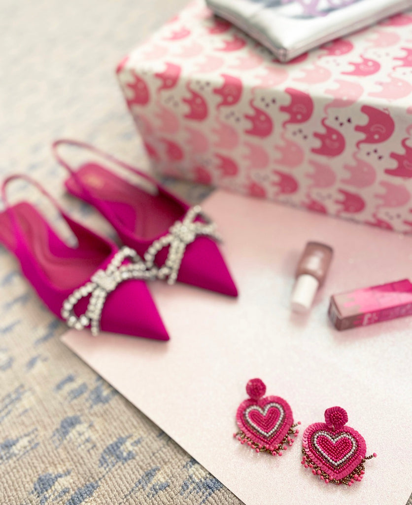 Colorful fuchsia heart earrings with a fun and playful patch design, adding a pop of texture.