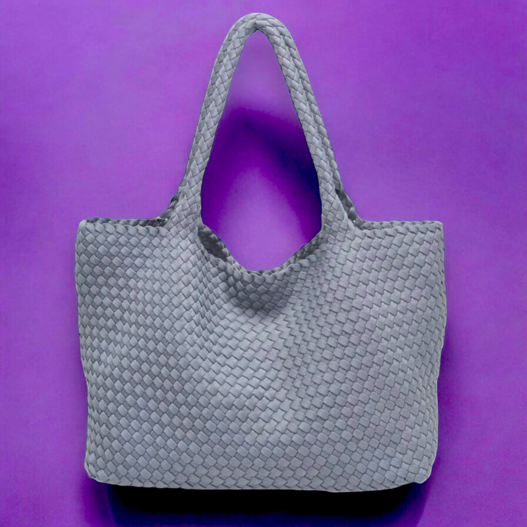 Modern grey tote featuring a stylish basketweave pattern, made from lightweight neoprene, ideal for carrying essentials with a touch of elegance.