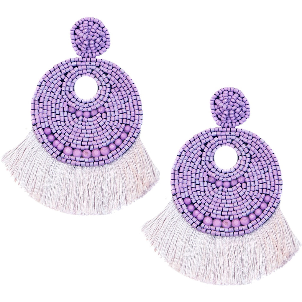 Statement lilac earrings featuring beaded fringe details and playful tropical patches.