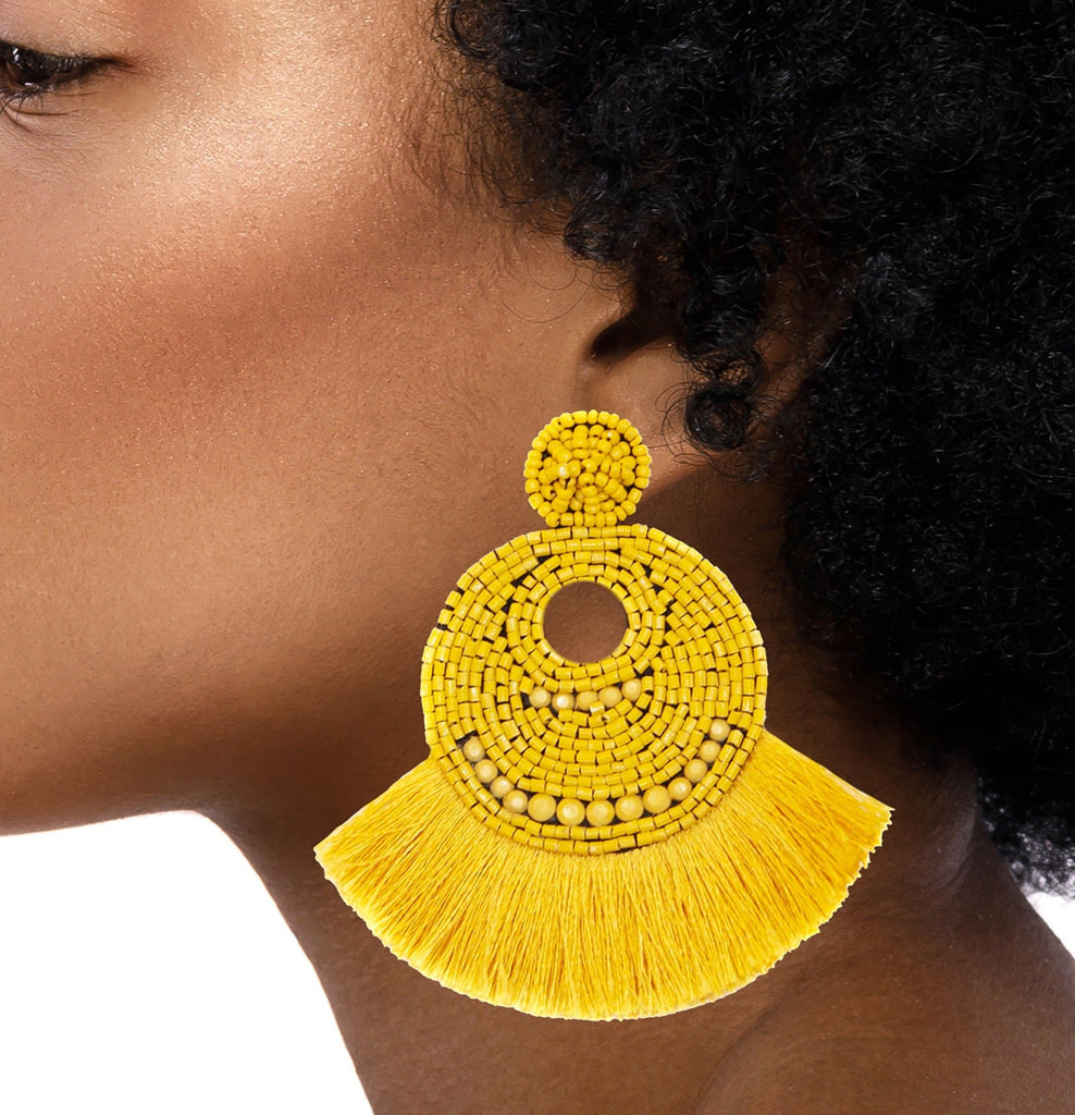 Yellow beaded earrings with bold fringe and a "BABE" patch, designed for a fun and joyful fashion statement.