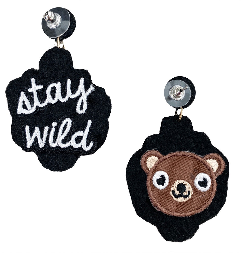 Handcrafted silver earrings with detailed beadwork and a unique "Monkey Business" patch, adding a touch of fun to an elegant design.