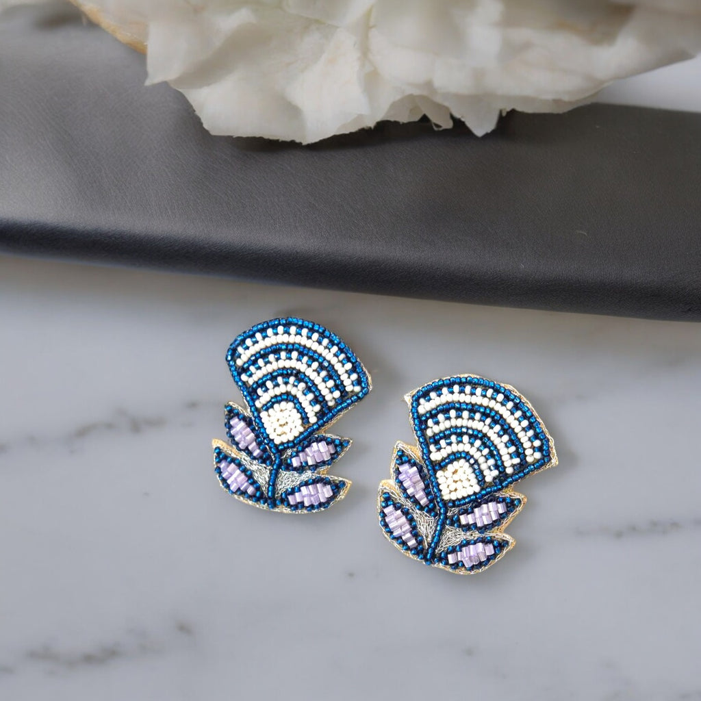 Handcrafted blue and white Aztec lily earrings.