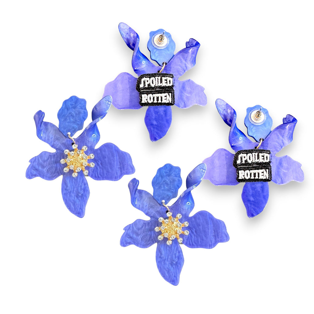 Elegant blue flower earrings with crystal embellishments.
