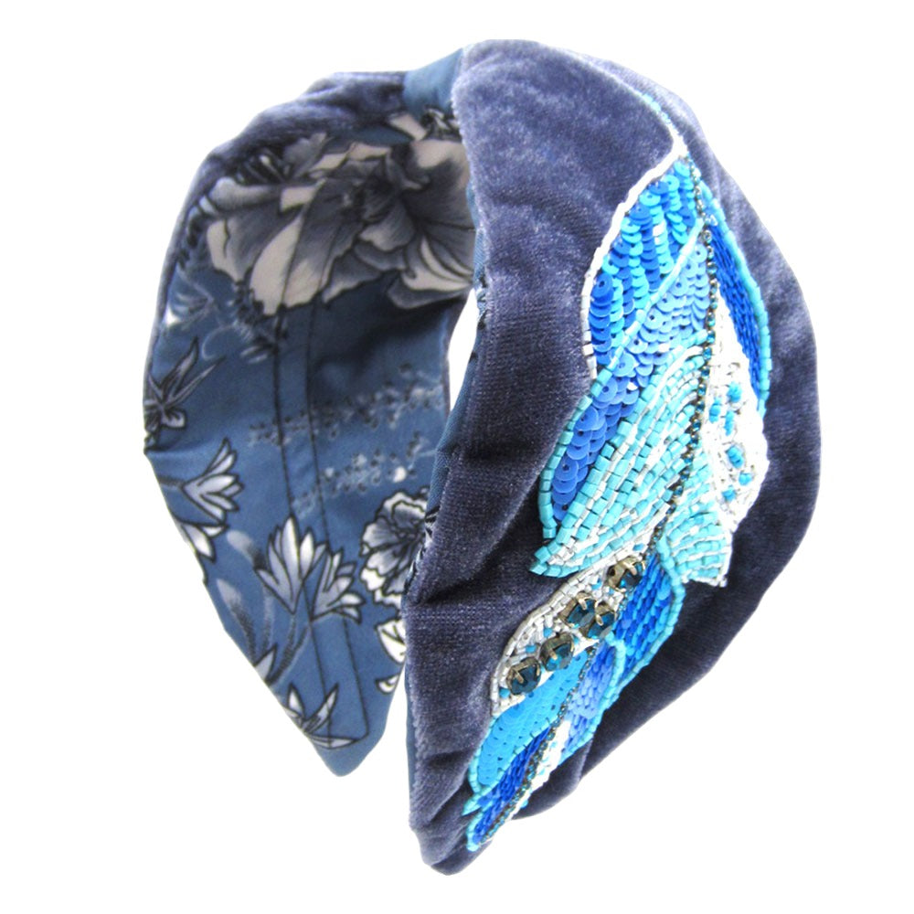 Blue velvet headband with sparkling embellishments, perfect for casual and formal wear.