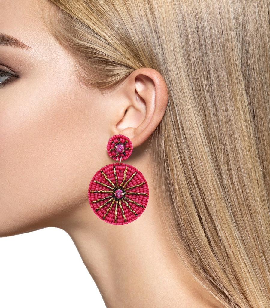 Colorful statement earrings in fuchsia with fun "Stay Wild" and lion patches, perfect for adding a playful touch to any look.