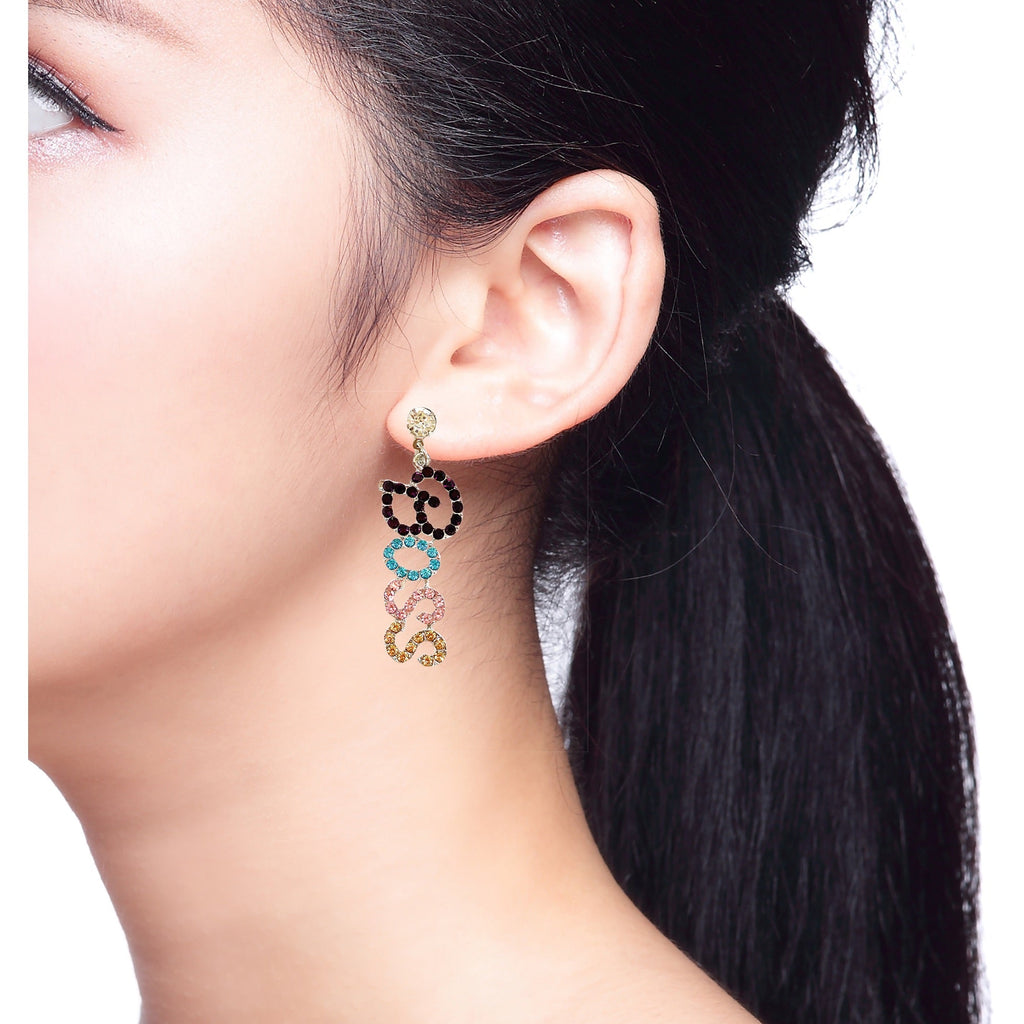 Long drop earrings with a unique sunset design in faux leather for a lightweight statement piece.