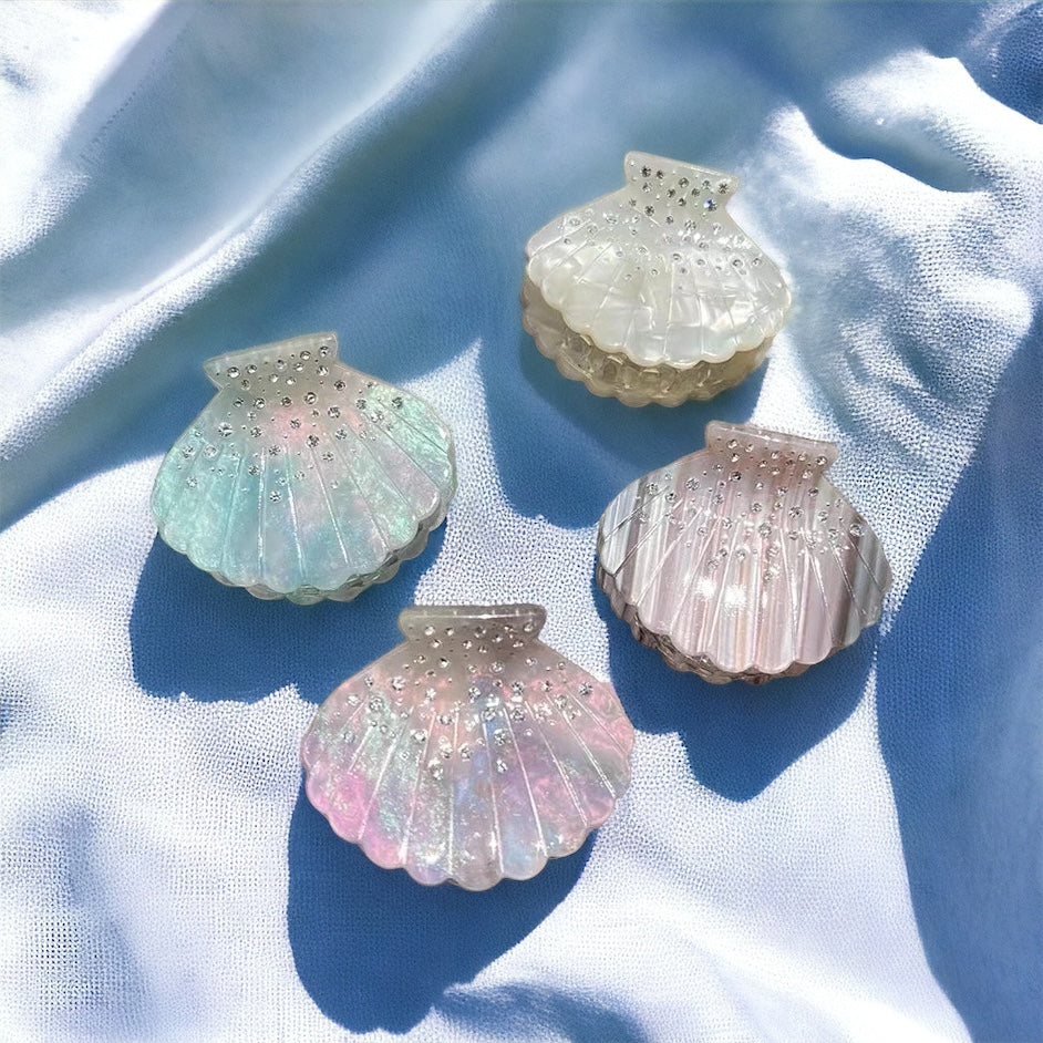 Iridescent seashell hair clips, designed for beach lovers and mermaid-inspired styles.