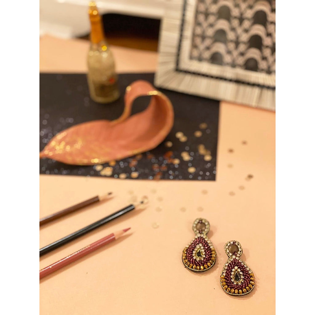 Handmade hypoallergenic bronze earrings with intricate beaded design and unique detail.