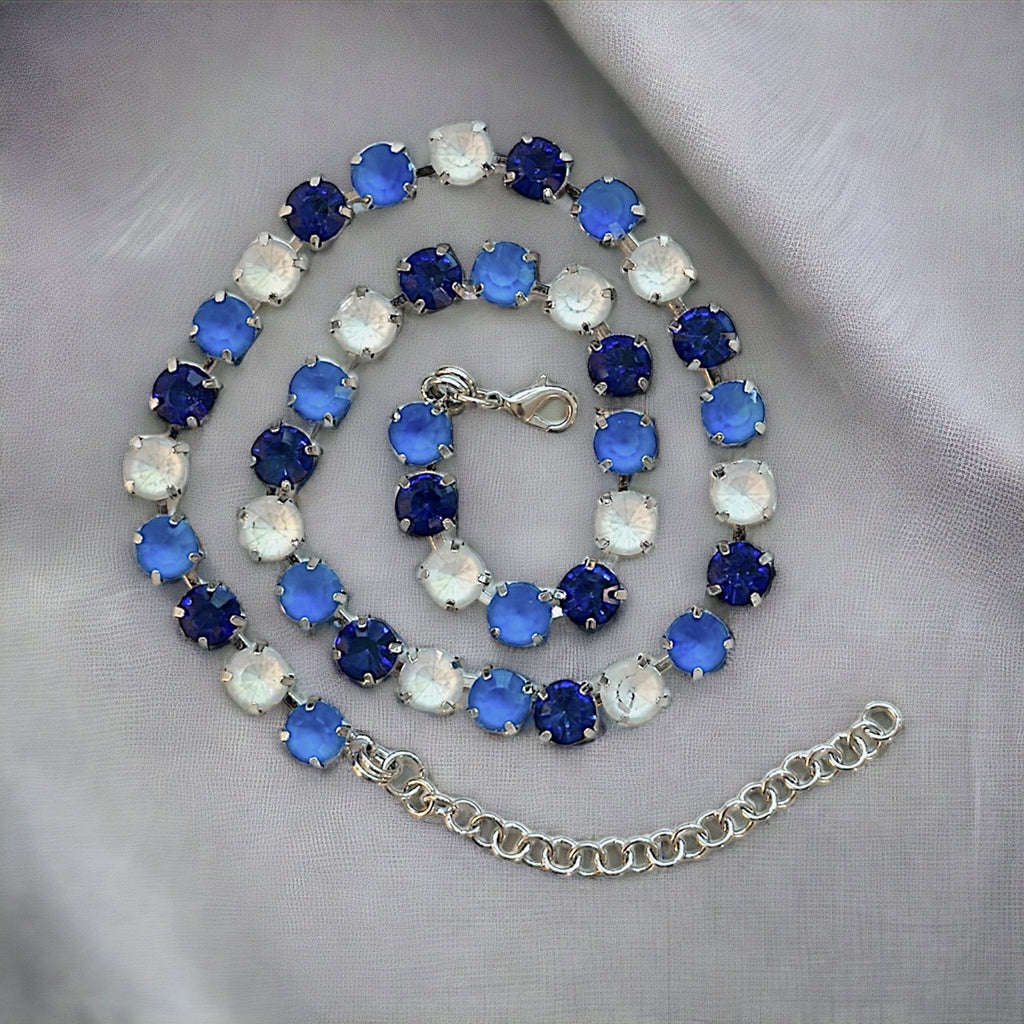 Handcrafted crystal gemstone necklace featuring lapis lazuli beads with a sterling silver clasp for elegance and durability.