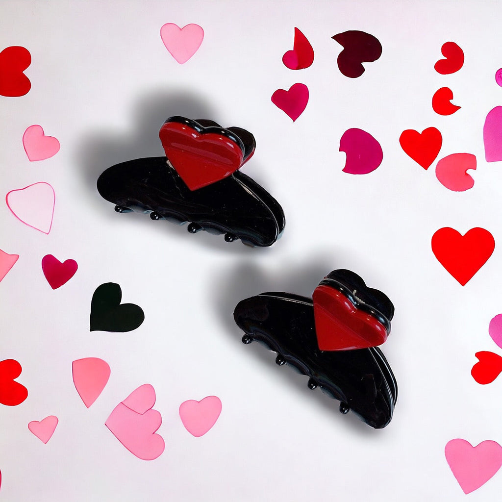  Black hair claws with red heart design surrounded by colorful hearts, perfect for a romantic touch.