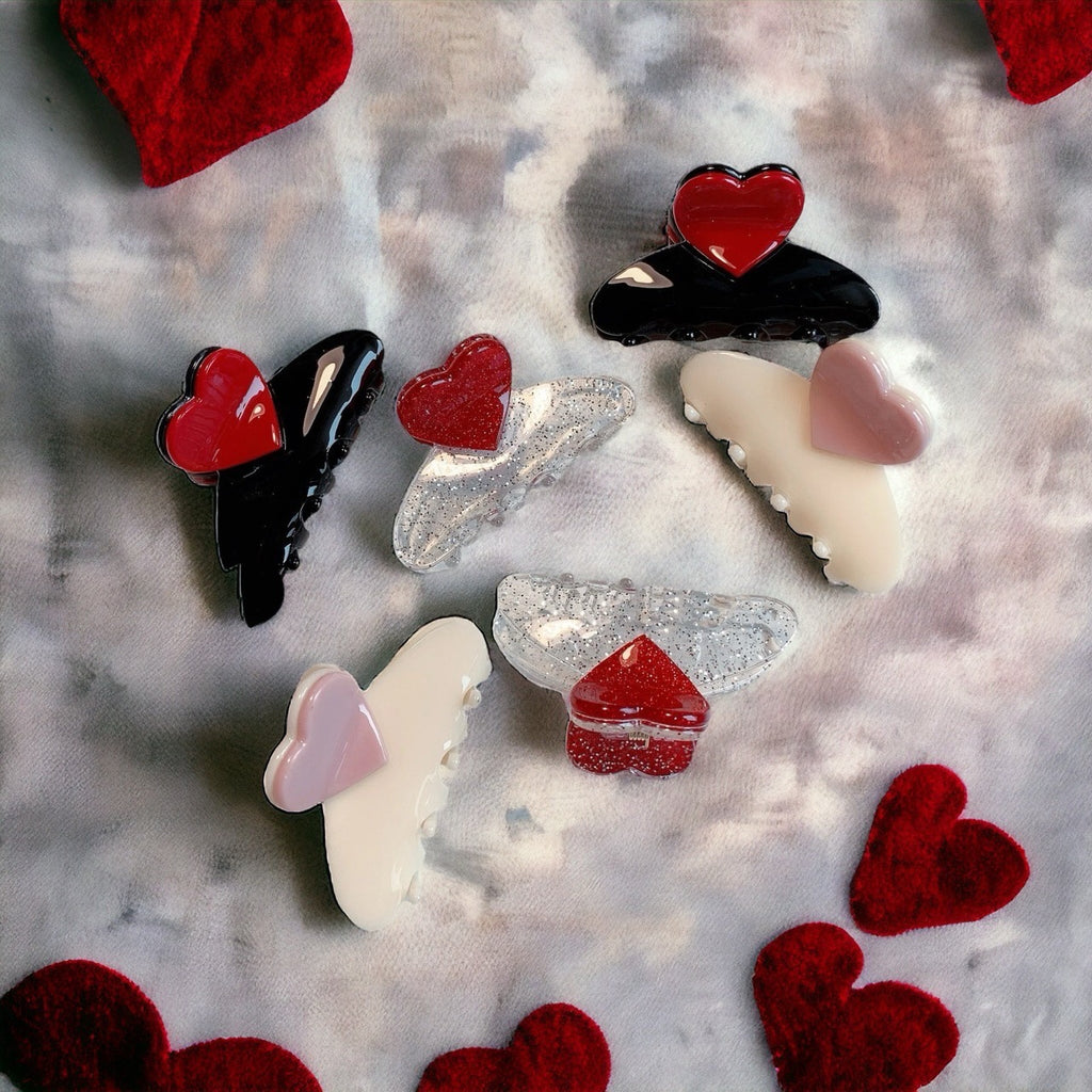 set of two black hair clips featuring a bold red heart, ideal for Valentine's Day.