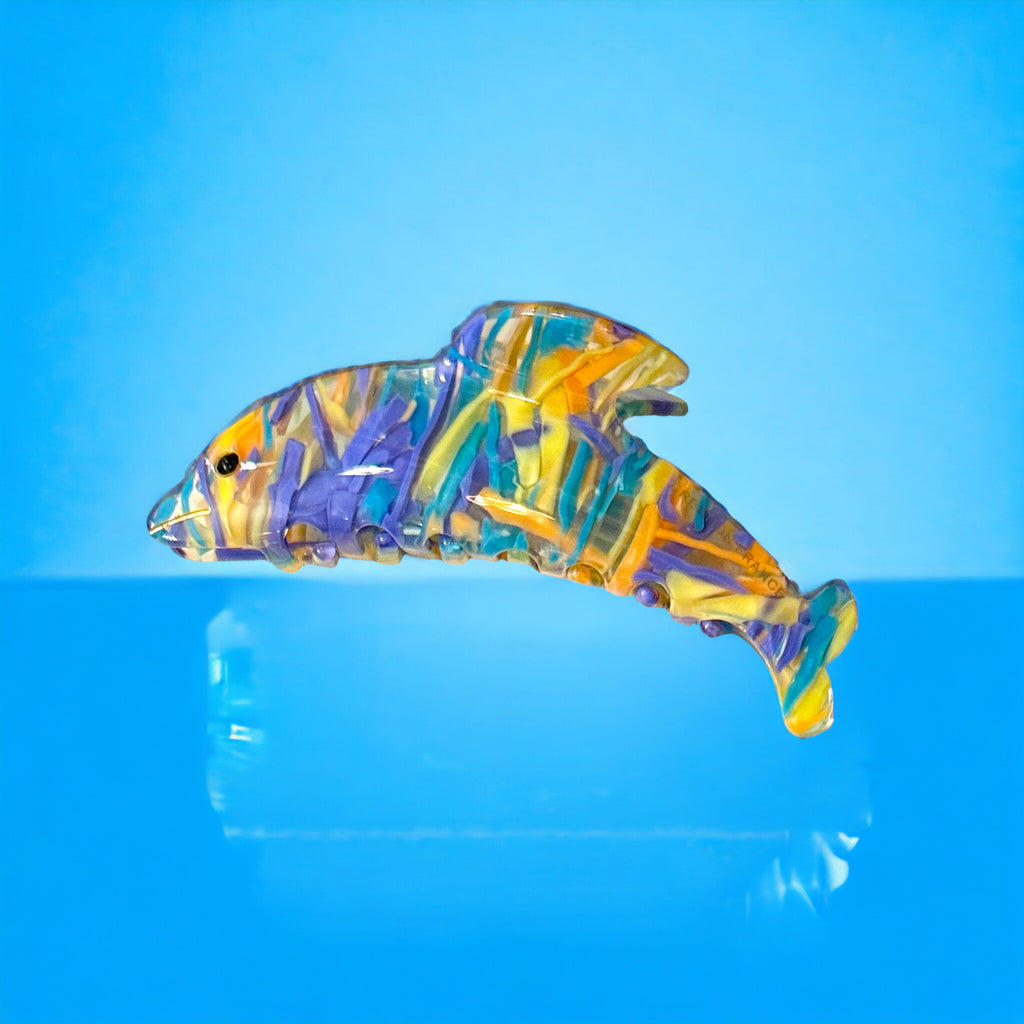 Dolphin Hair Clip in vibrant blue and peach hues, perfect for adding a playful touch to any hairstyle.