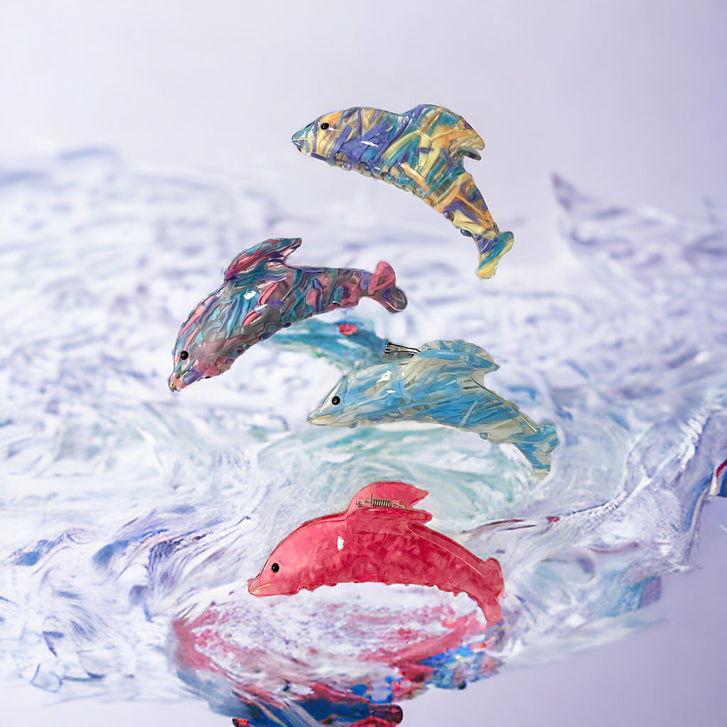 Cute dolphin-shaped hair clips in stunning hues, perfect for a nautical-themed look.