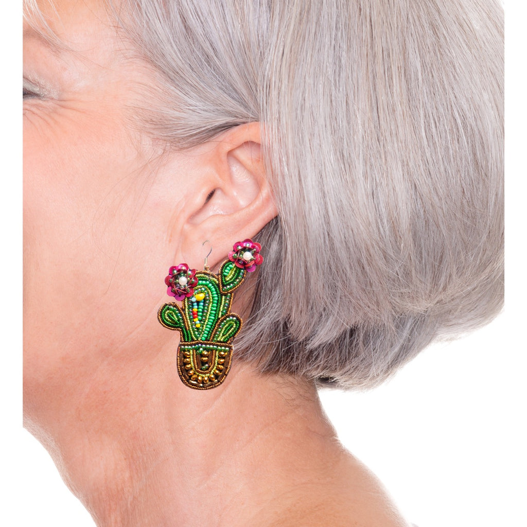 Artistic green cactus drop earrings with hypoallergenic materials and fun patch detail.