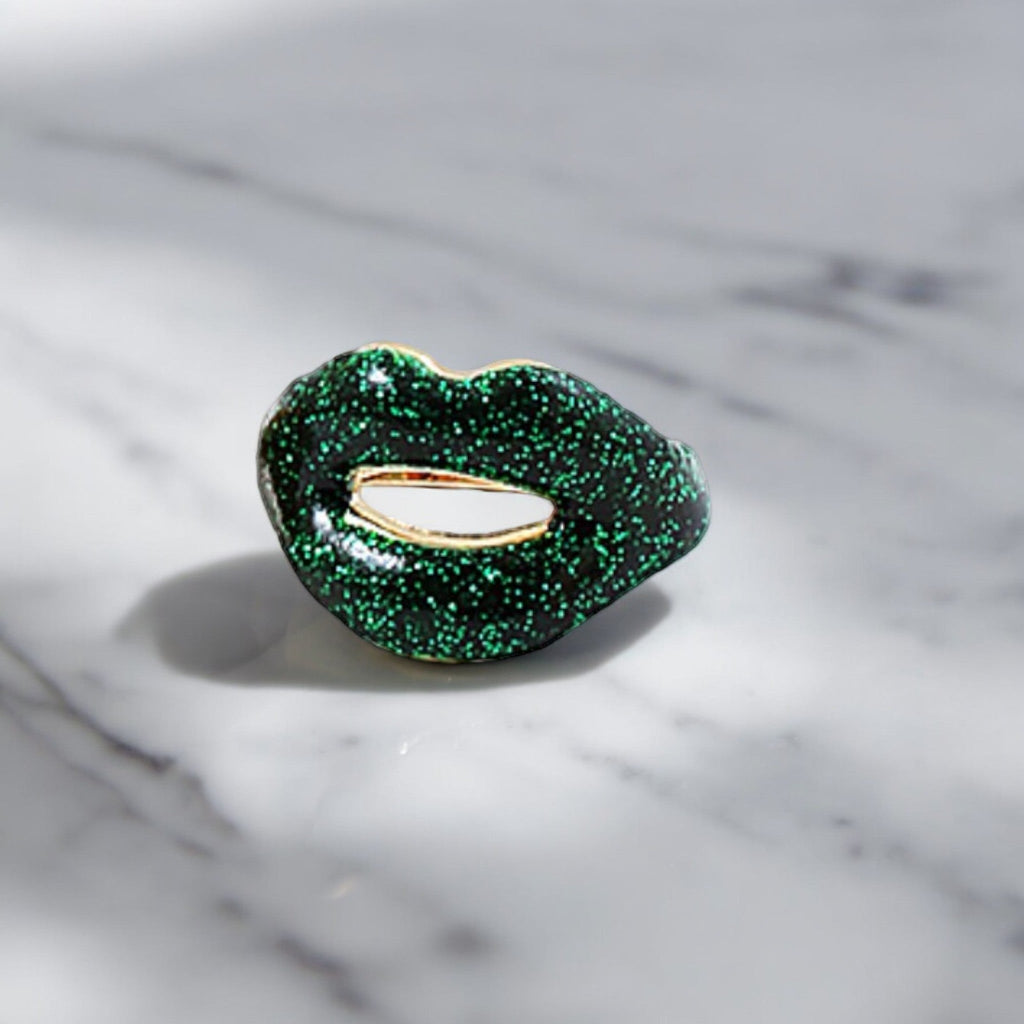 Vibrant green glitter ring with a puckered surface, adding a fun and edgy element to your jewelry collection. Its bold hue and unique texture make it a statement piece for any occasion.