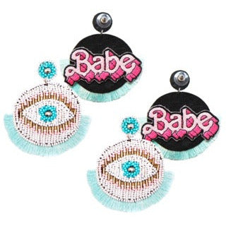 Handcrafted evil eye earrings with hypoallergenic materials and "Babe" patches.