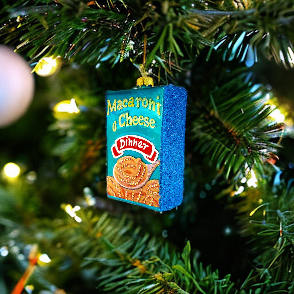 Cheesy glass ornament featuring a mac and cheese design, perfect for adding humor and fun to your Christmas tree.