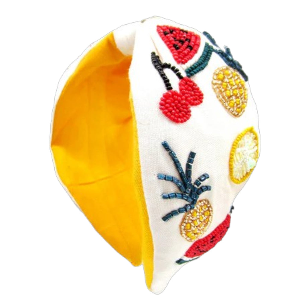 Vibrant beaded headband with tropical fruit embellishments on a yellow and white base.