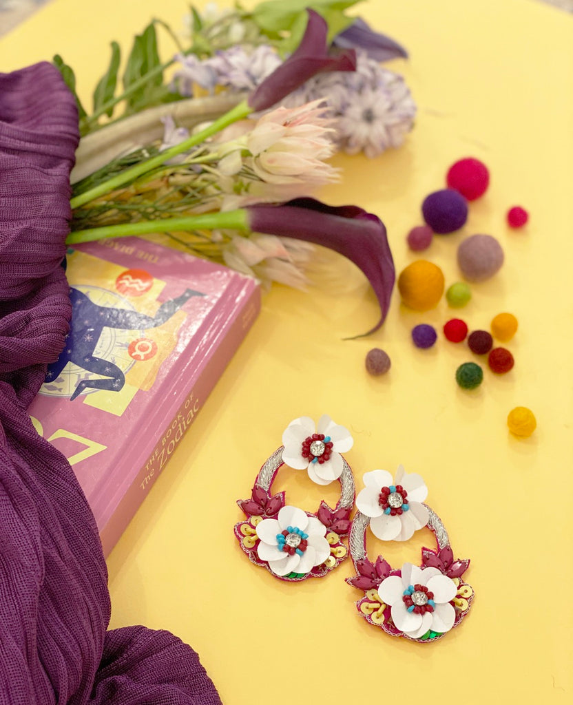 Full Bloom Earrings in magenta with embroidered flowers and a quirky "Can’t Even" patch, perfect for casual chic looks.