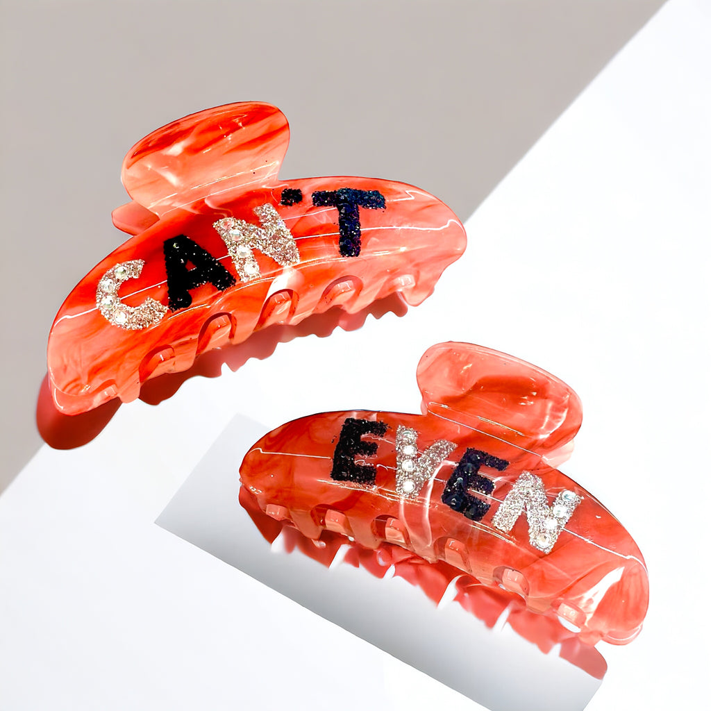 Stylish red marble hair clip featuring glitter "Can't Even" lettering for a playful, secure hold.