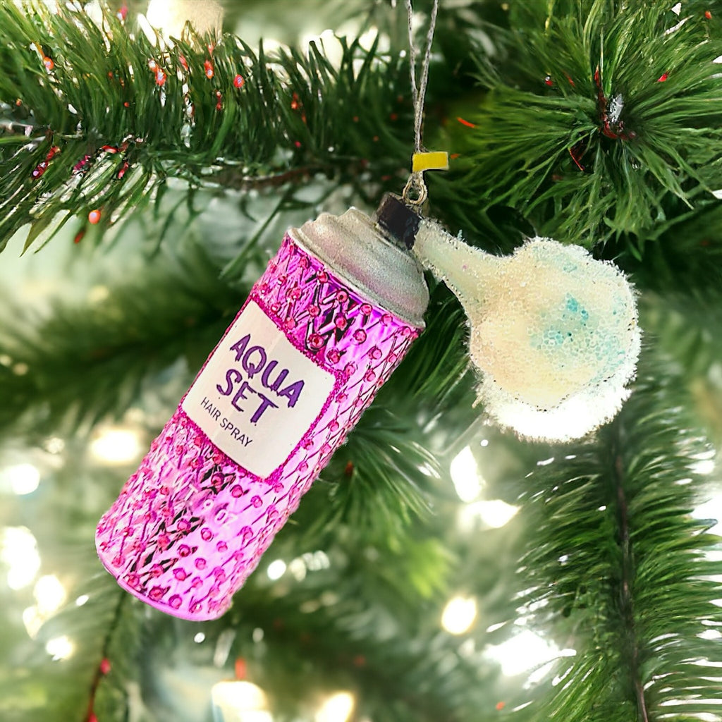 Sparkling pink ornament shaped like a vintage hairspray bottle, ideal for beauty enthusiasts and retro lovers.