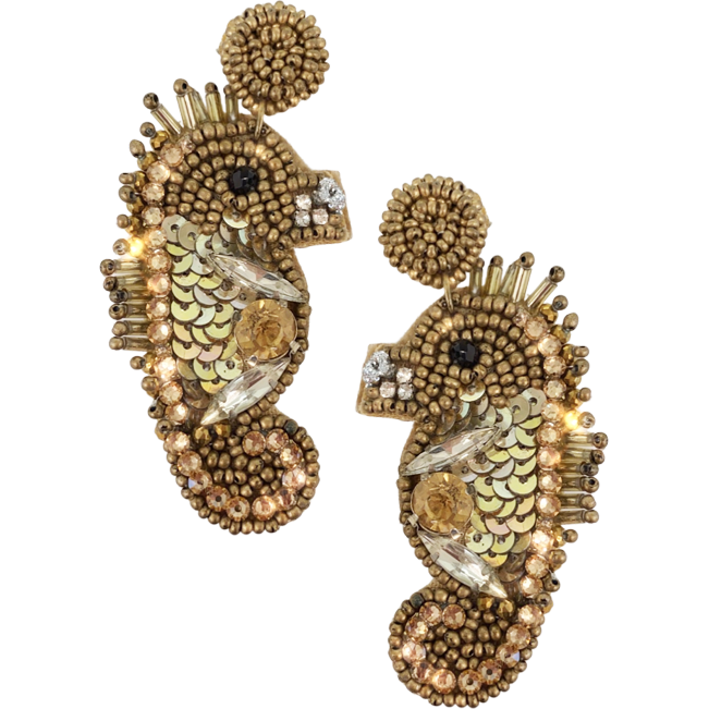 Nautical-themed seahorse earrings with gold-colored beads and sparkling rhinestones, complete with a motivational "Trust the Universe" patch.