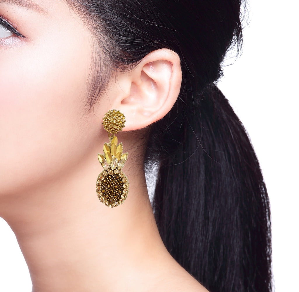 Tropical-themed gold and bronze pineapple earrings, perfect for adding sparkle to any outfit.