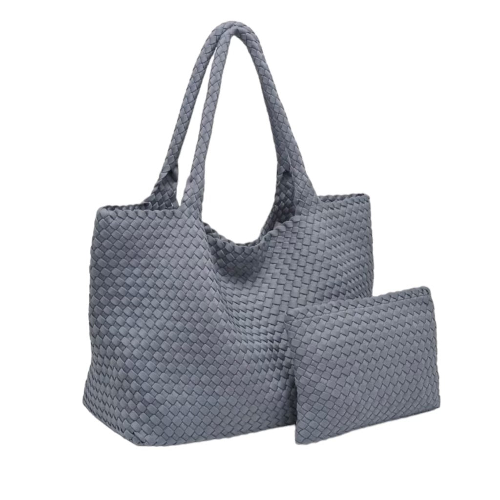 Elegant grey tote bag with a textured basketweave design, crafted from neoprene for a blend of style, durability, and spacious storage.