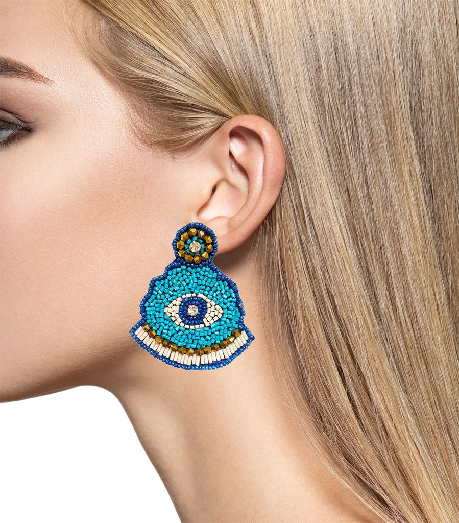 Lightweight blue and bronze earrings with an evil eye symbol and playful patch design for a unique look.