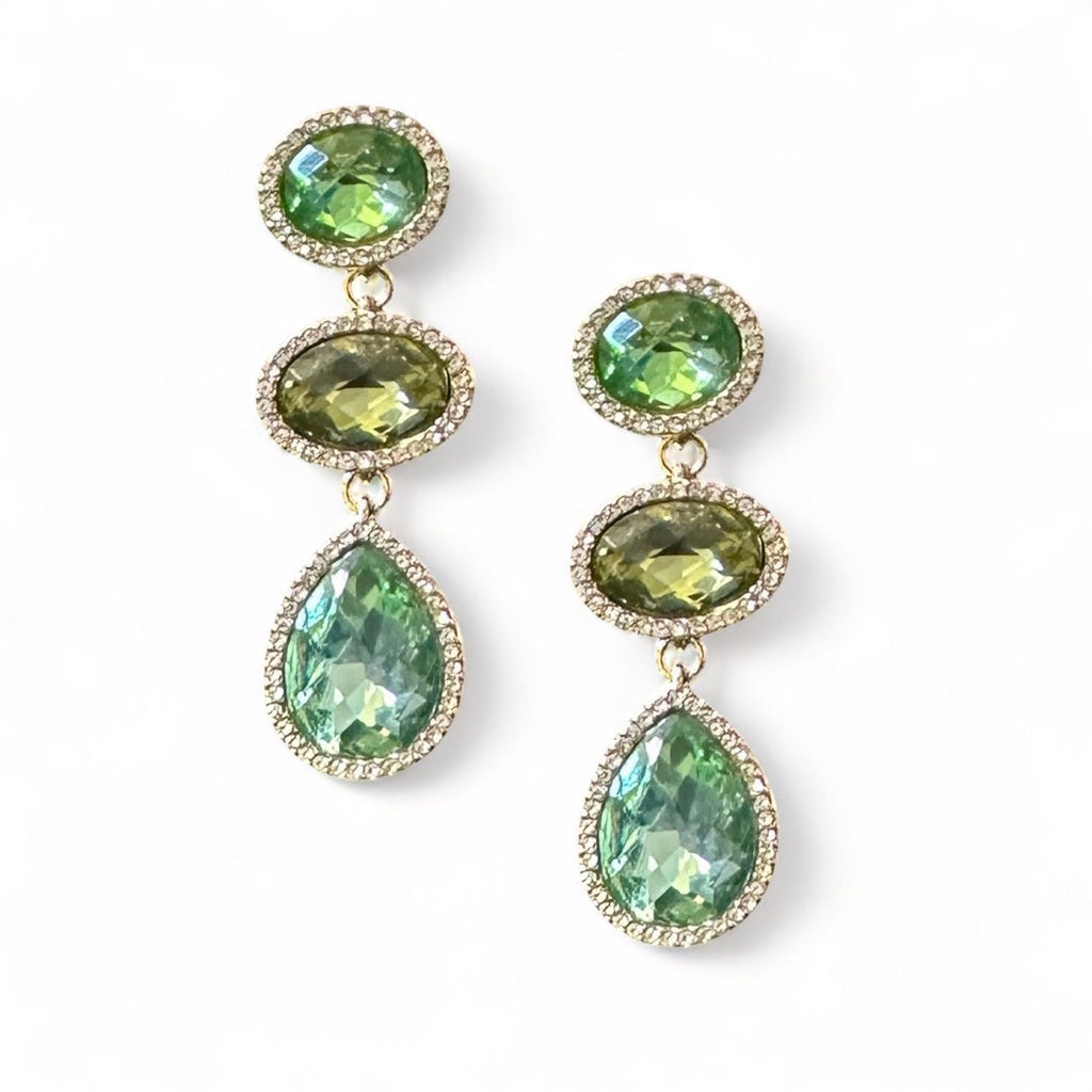 Exquisite jade drop earrings gracefully suspended from intricate gold detailing, exuding elegance and sophistication.
