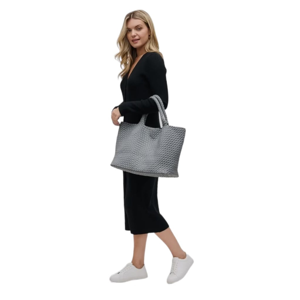 Fashionable and practical grey neoprene tote with a basketweave design, perfect for daily use and travel.