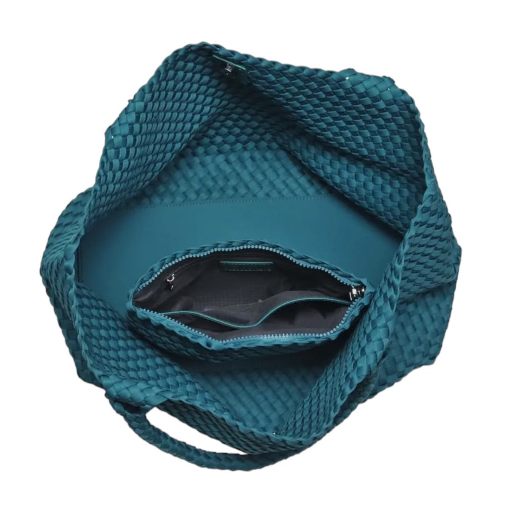 Stylish teal tote bag with a unique basketweave design, lightweight and spacious, ideal for everyday use.