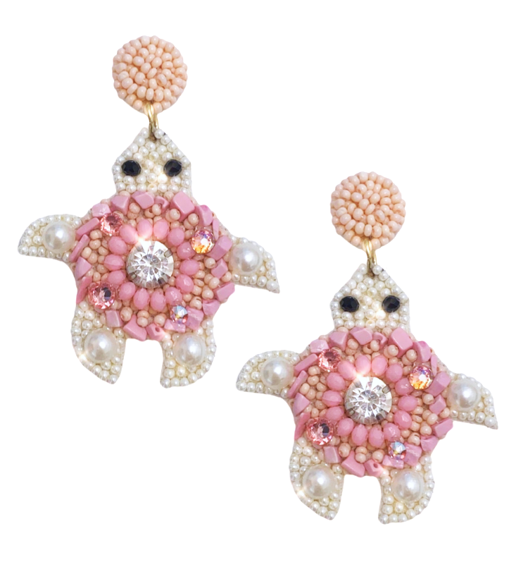 Lightweight pink turtle earrings with beaded detailing and a "Nope" patch, ideal for adding a quirky touch to any outfit.