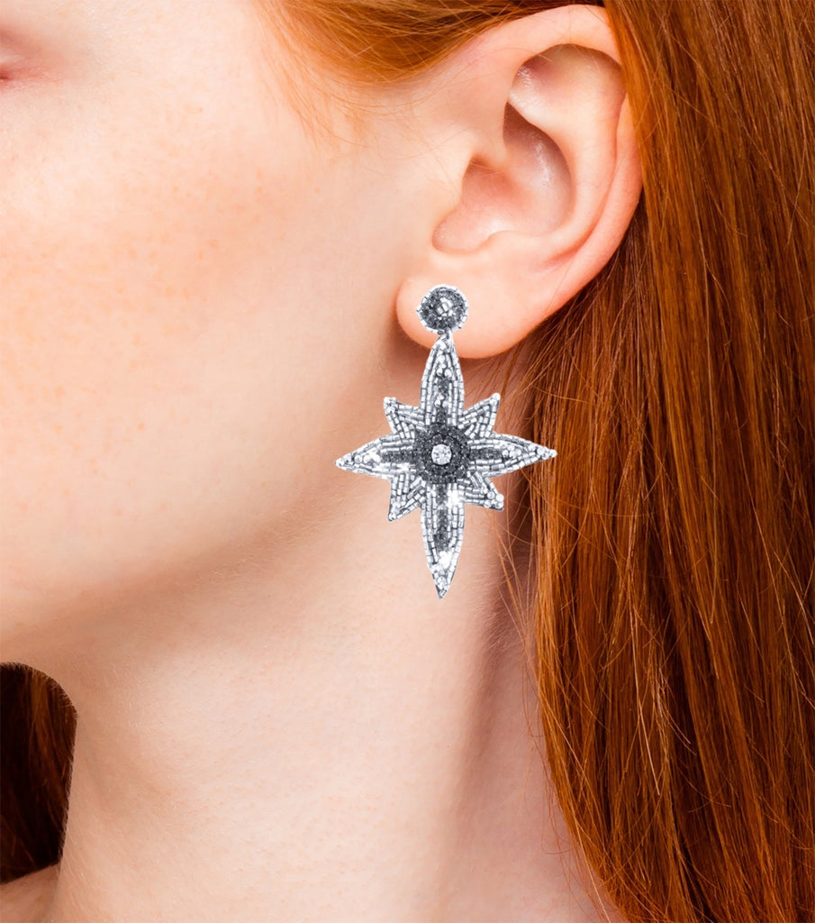 Elegant and fun star-shaped earrings with beaded details and emoji patch design, perfect for formal and casual events.