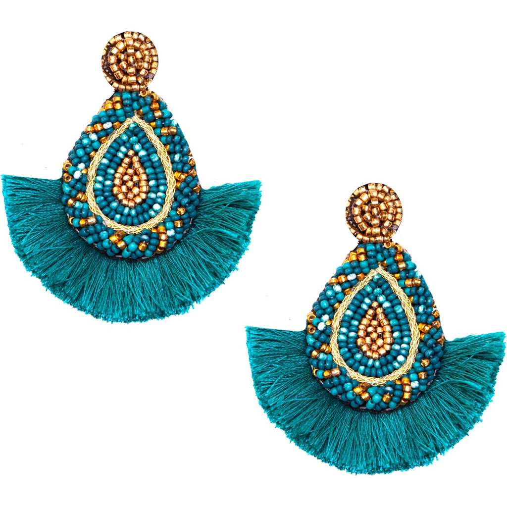 Lightweight turquoise tassel earrings with bold seed bead accents and a cheeky patch design, perfect for summer.