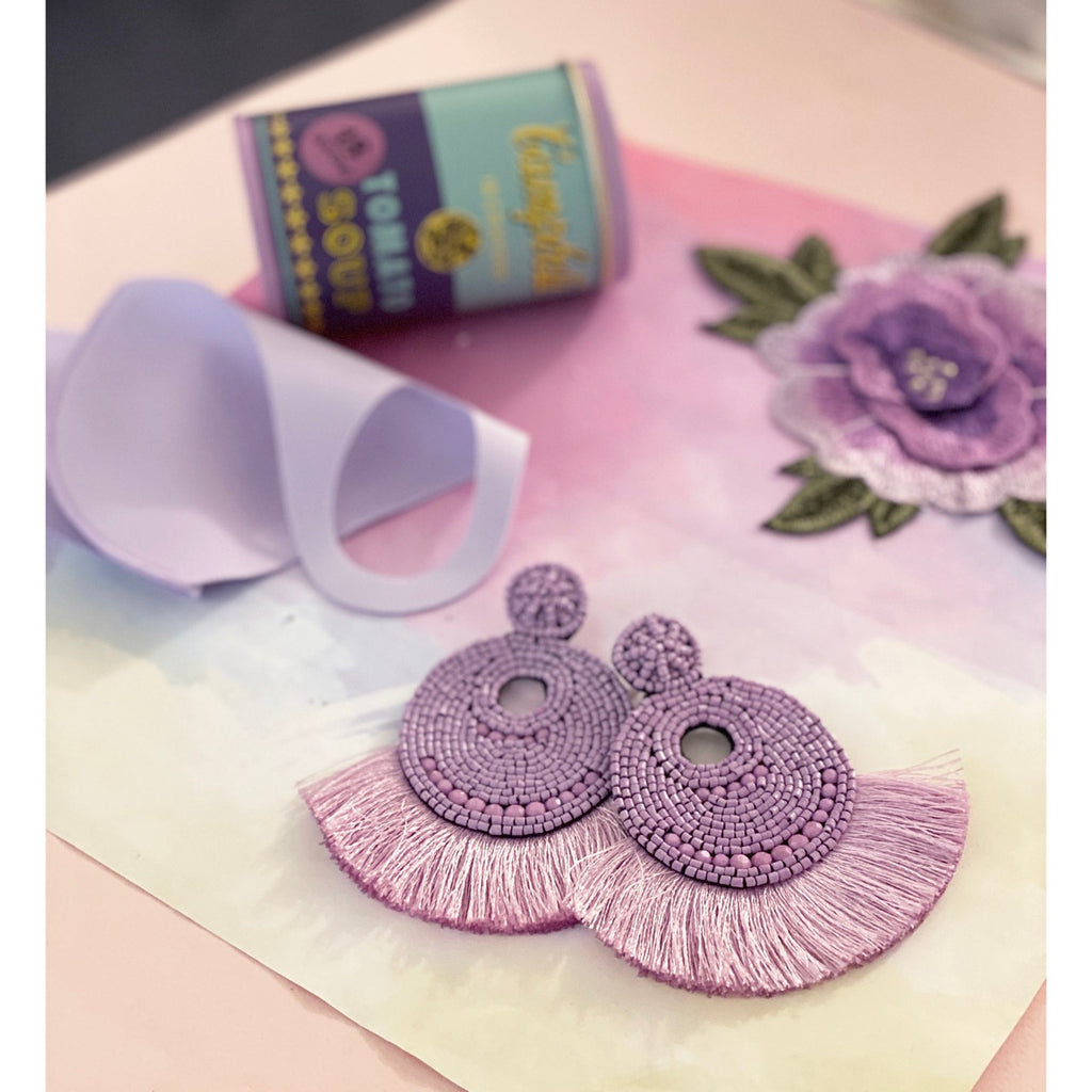 Chic lilac fringe earrings with beaded design and "Out of Office" and palm tree patches for a fun summer look.