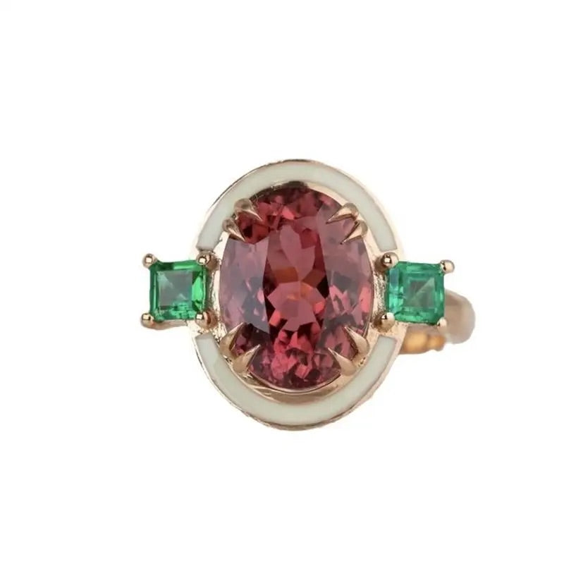 Fashion statement ring with faux rose tourmaline and emerald accents in a gold-tone finish.