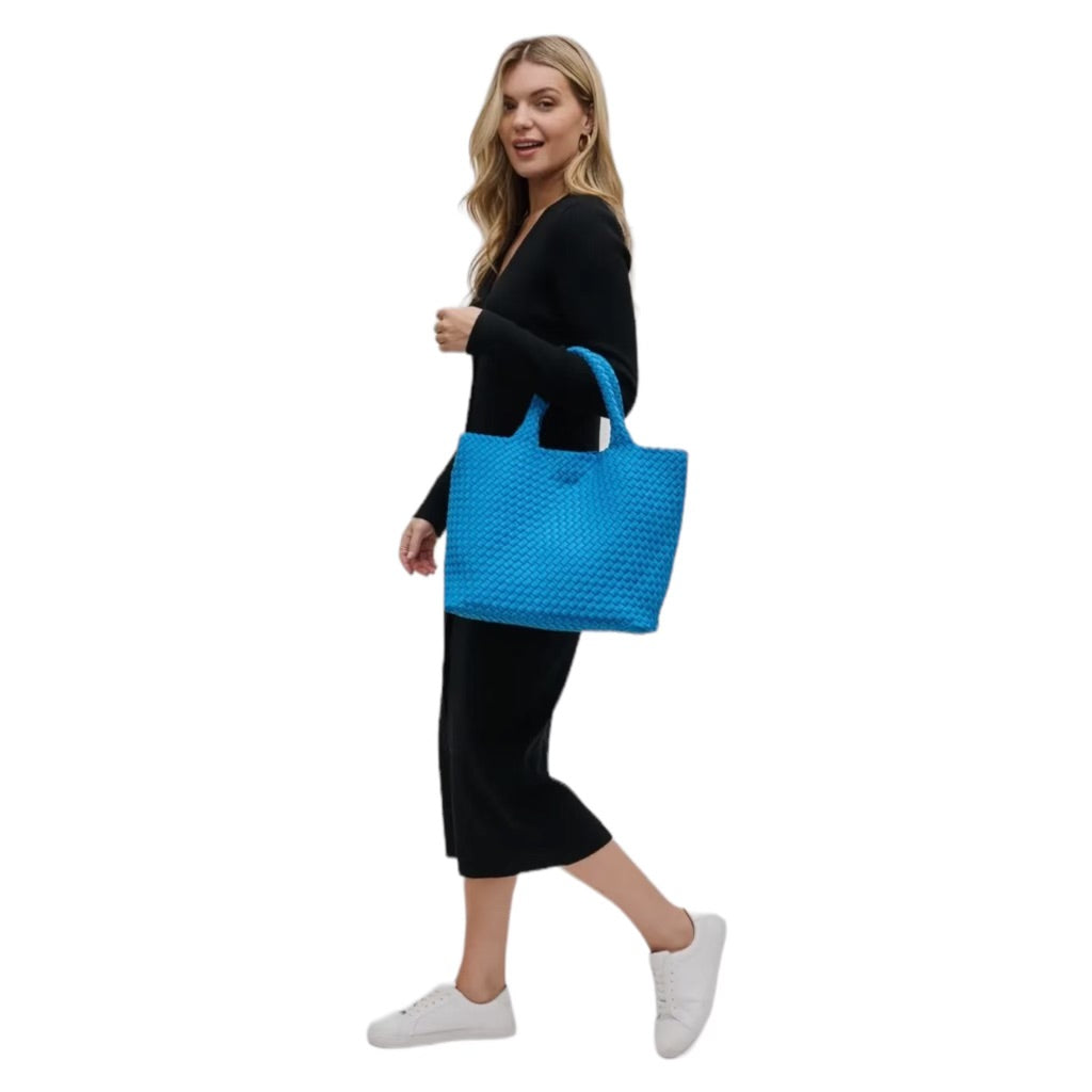 Stylish aqua basketweave tote bag made from neoprene, lightweight and perfect for casual outings or beach trips.