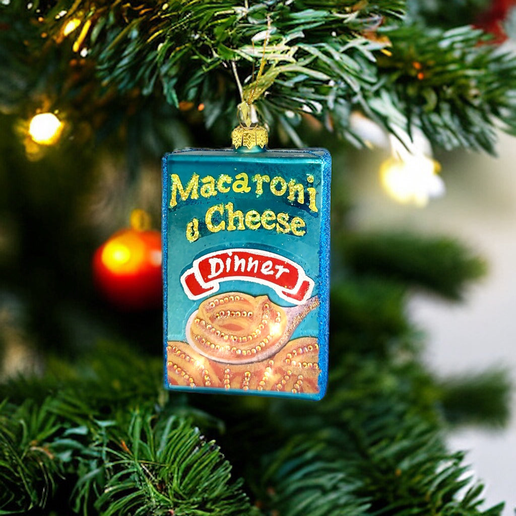 Mac & Cheese Ornament made of glass, featuring a playful mac and cheese design, perfect for adding a cheesy touch to holiday decor.