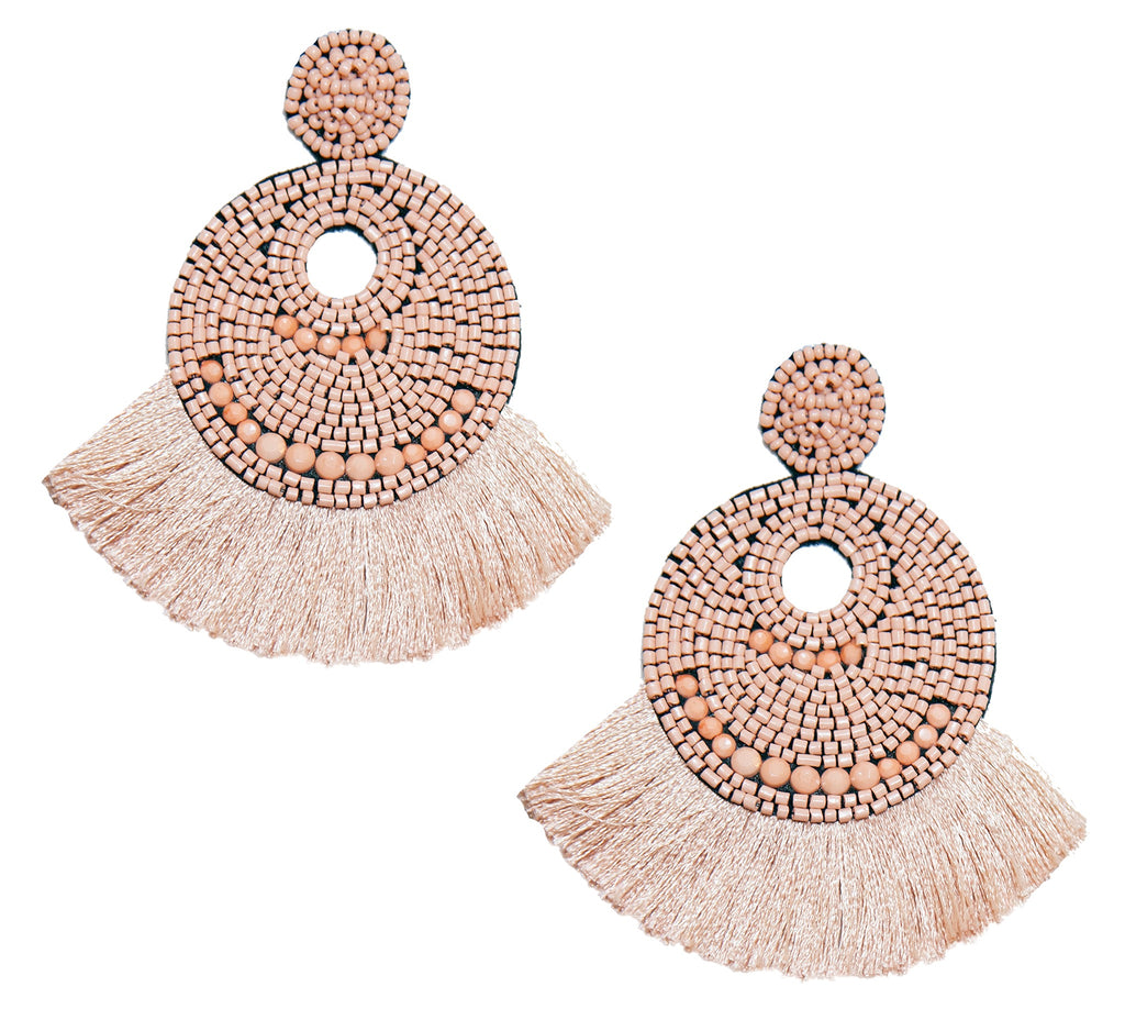 Lightweight nude statement earrings featuring double fan fringe and seashell design.