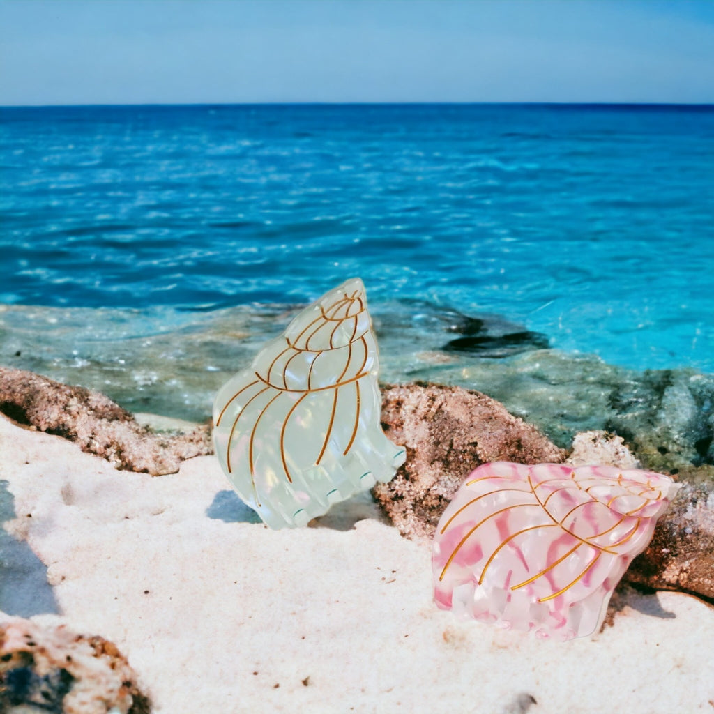 Conch shell-shaped hair clips, ideal for ocean lovers and those who enjoy coastal-themed accessories.