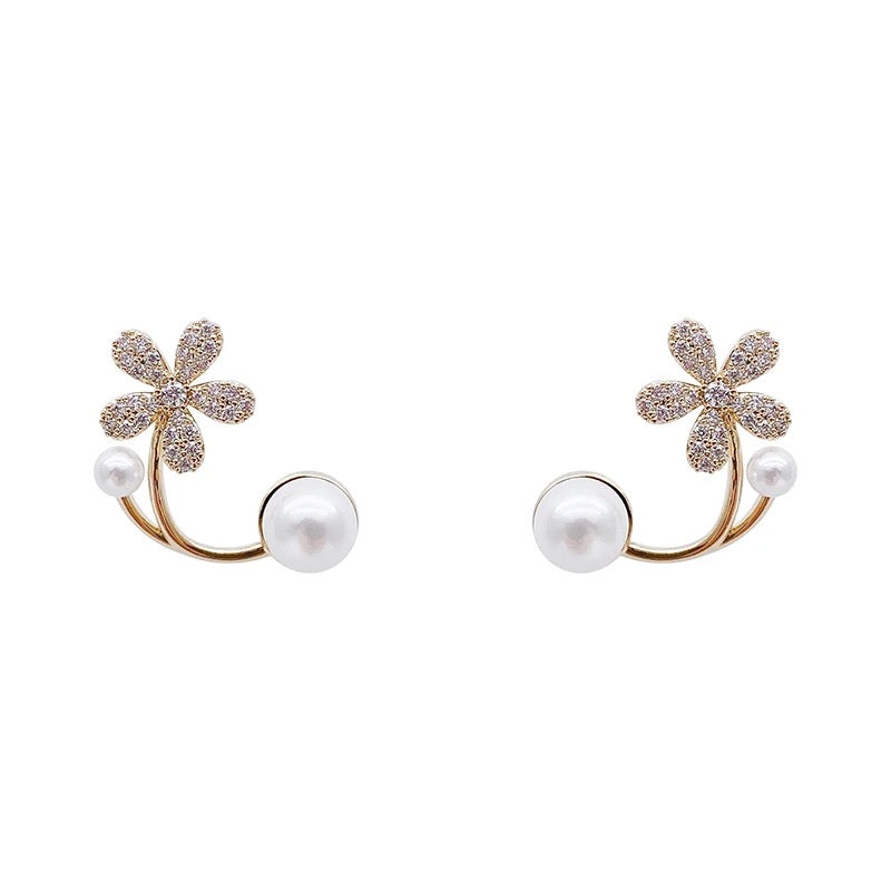 A pair of elegant and eye-catching handmade petal-shaped blossom earrings featuring shimmering stones.