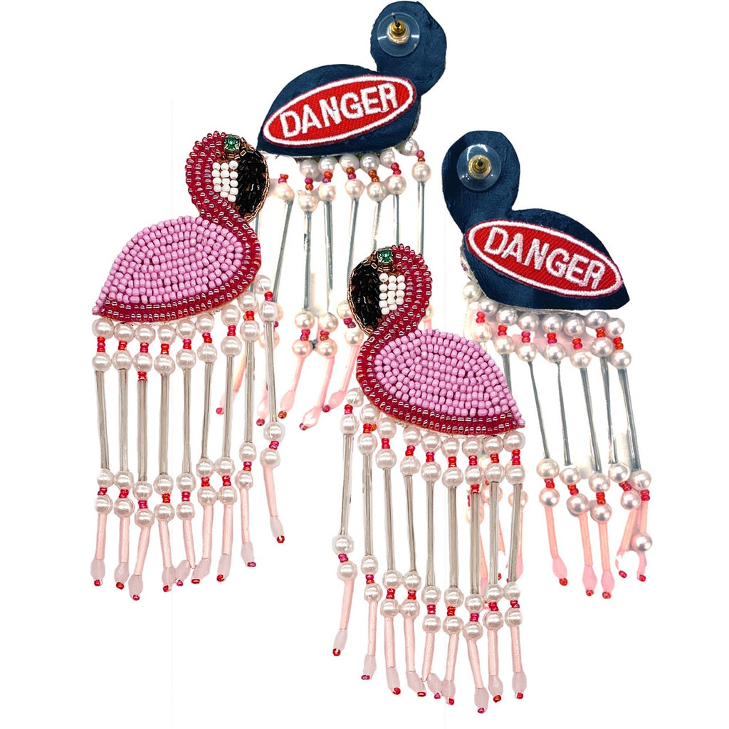 Pink and black beaded flamingo earrings with fringe and "Danger" text, a bold fashion statement piece.