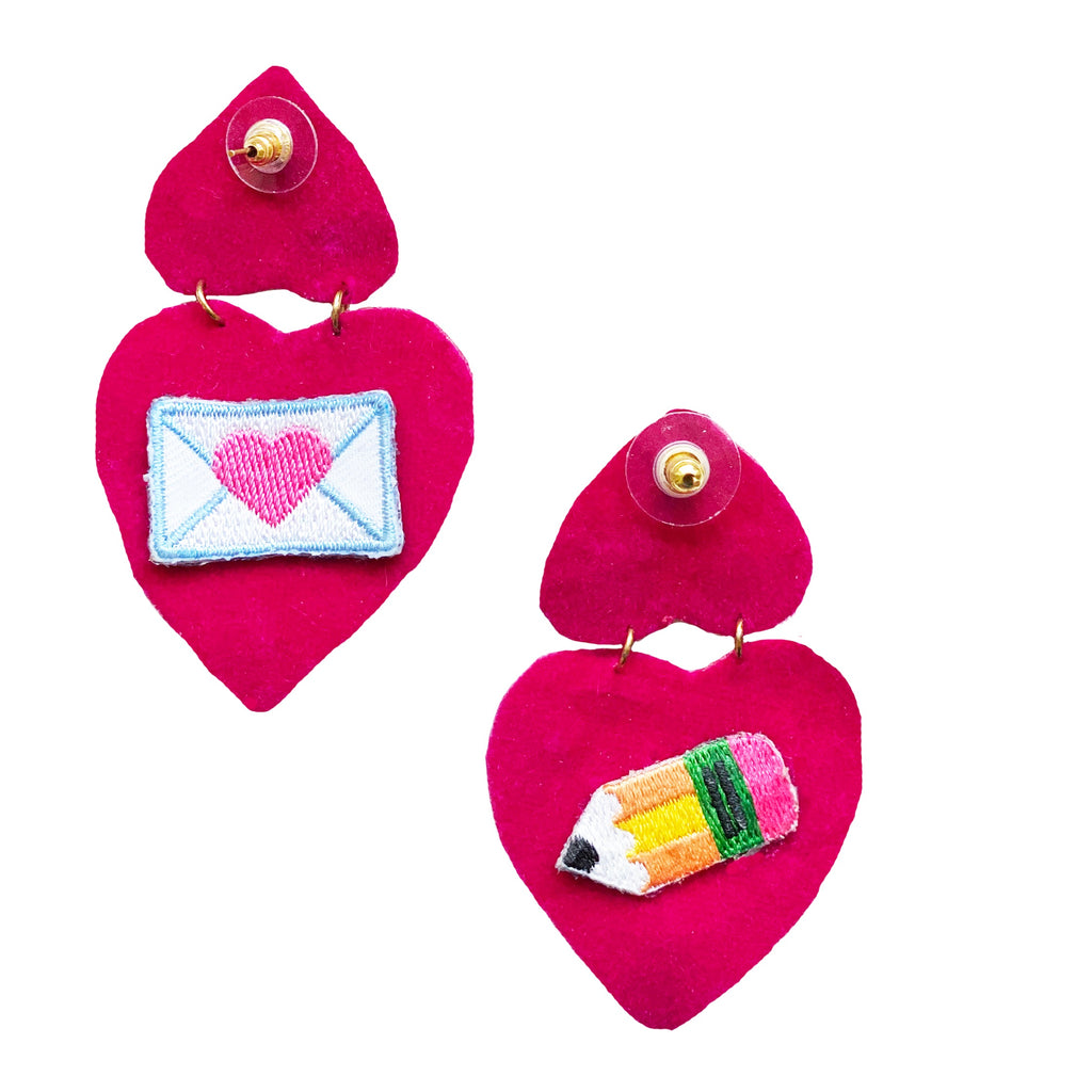 Handmade pink heart earrings with vibrant colors, adding a playful touch to any outfit.