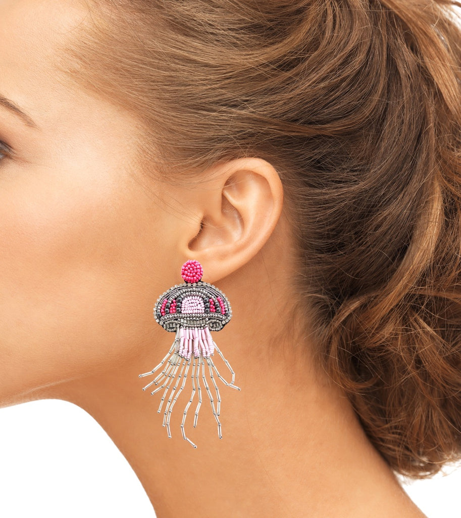 Handcrafted beaded jellyfish earrings featuring a feminist message, perfect for a unique fashion statement.