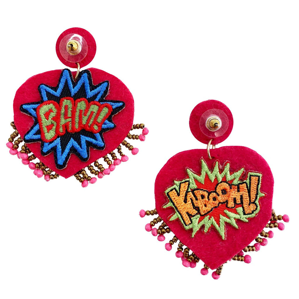 Bold fuchsia statement earrings with a playful pop-art patch design, perfect for adding color to any outfit.